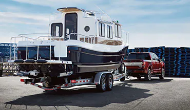 2022 Nissan TITAN Truck towing boat | Cherokee County Nissan in Holly Springs GA